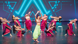 Instructor with dance ensemble